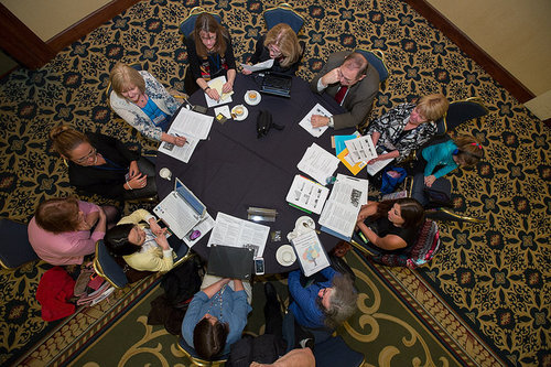 Photo of people engaged in a meeting.