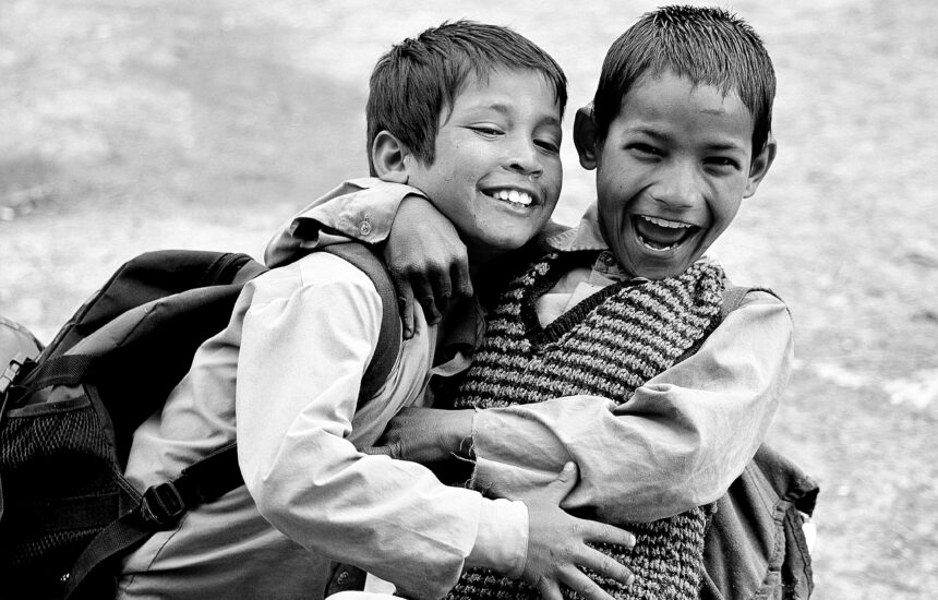 Black-and-white photo of two boys with smiles