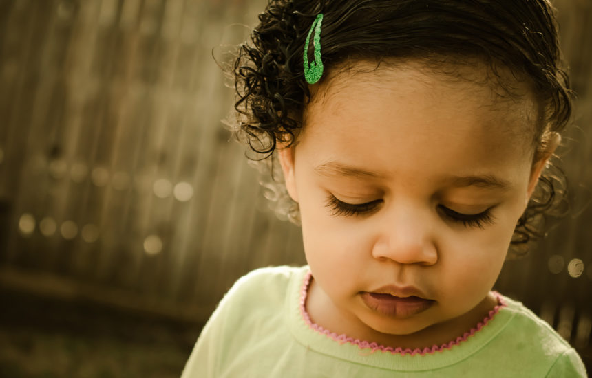 Close up photo of a young girl.