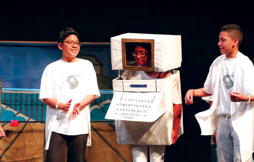 A group of kids giving a performance in costumes