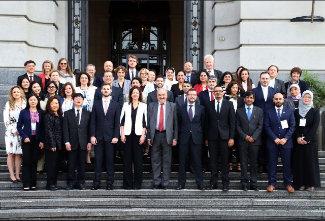Photo of a group of people on steps.