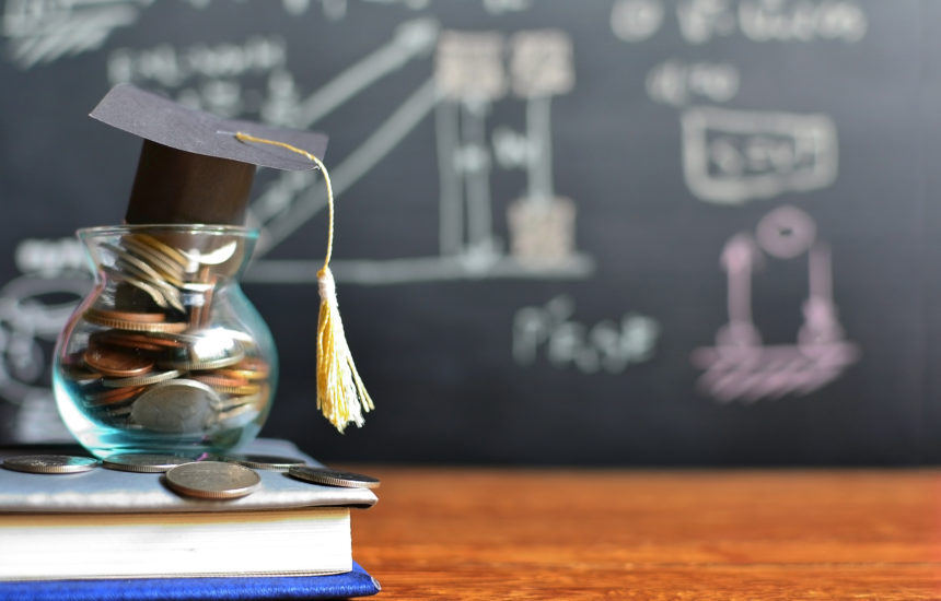 Photo of a graduation cap in a coin jar.