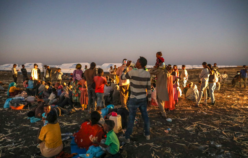 Group of migrants outside in a camp