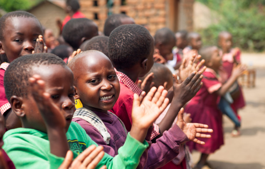 Children clapping in a line