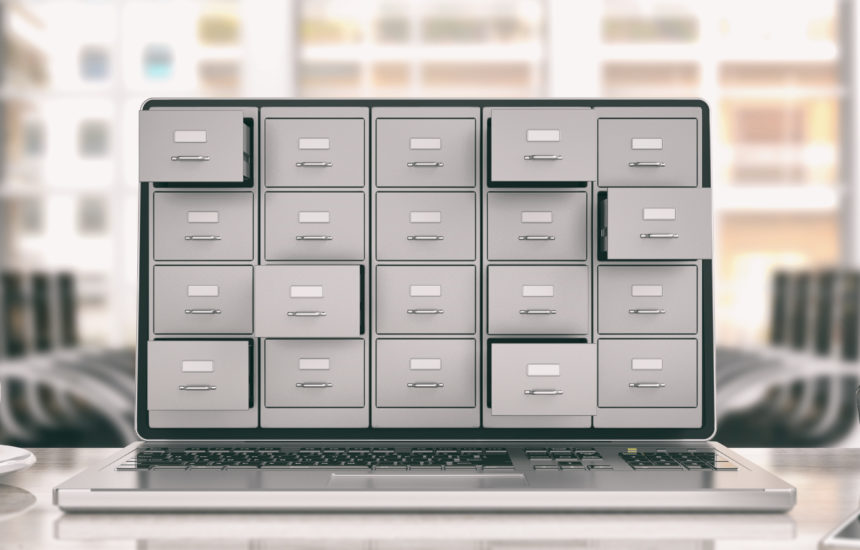 A laptop that has multiple file drawers coming out of the screen